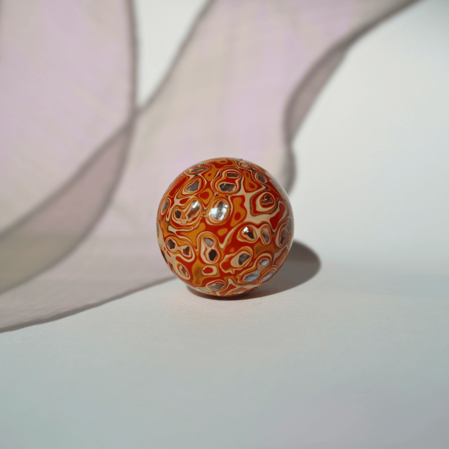 Flame Tangerine ritual bead in radiant orange with golden highlights, hand-polished resin_1