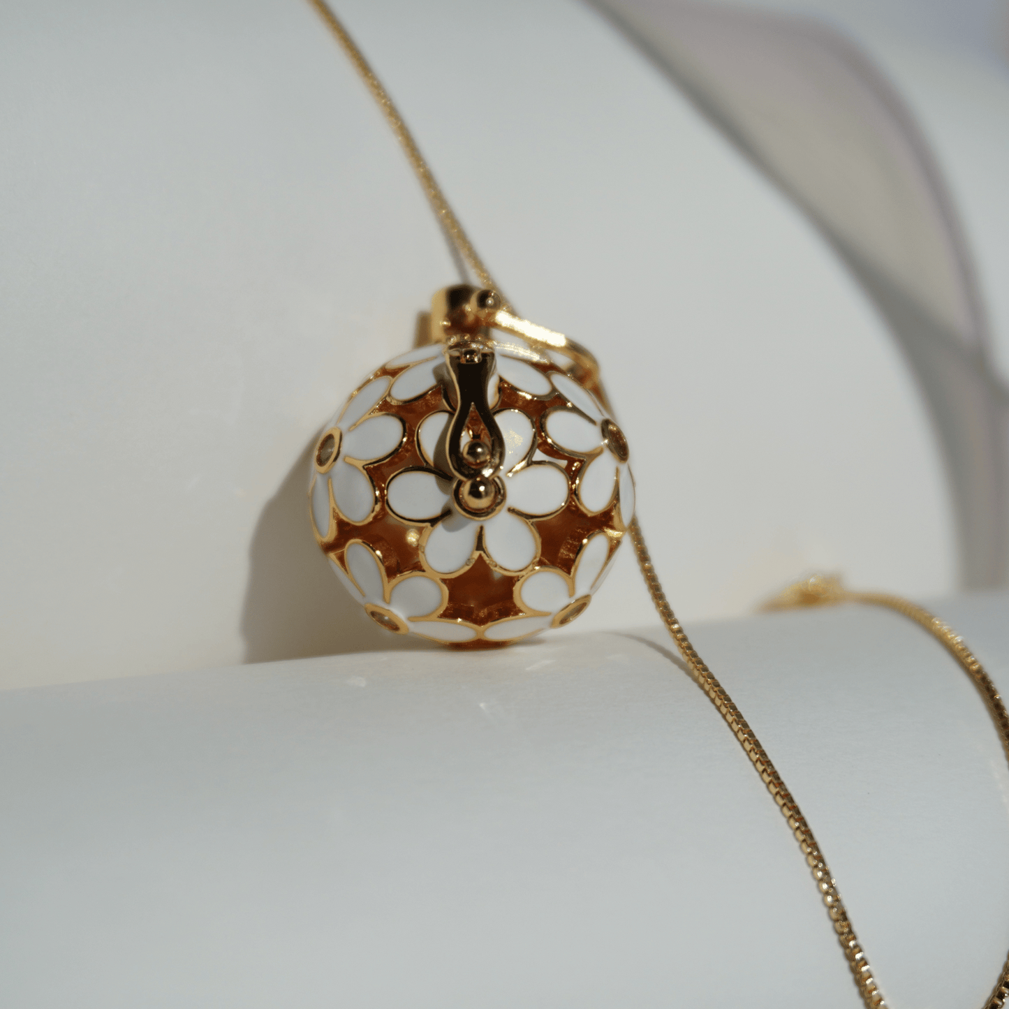 Gold floral cage pendant holder for ritual or crystal beads_close_up_with_chain