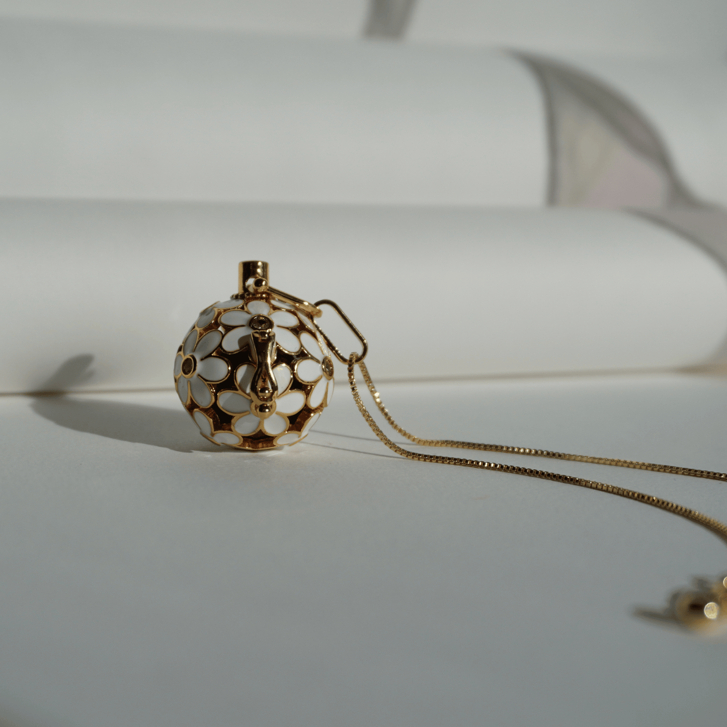 Gold floral cage pendant holder for ritual or crystal beads_upfront