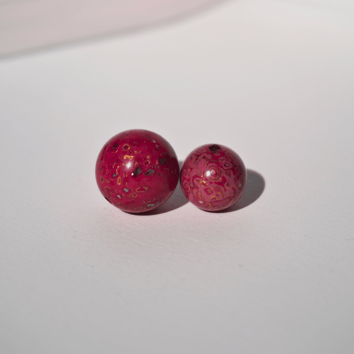 Raspberry Wine ritual bead with burgundy swirls in hand-polished organic resin_duo_beads