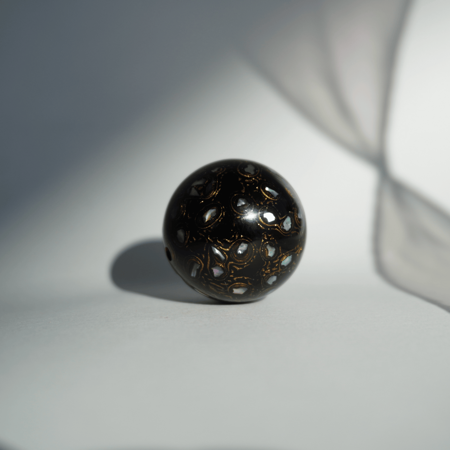 Rich Black ritual bead with high-gloss black finish, hand-layered organic resin_1