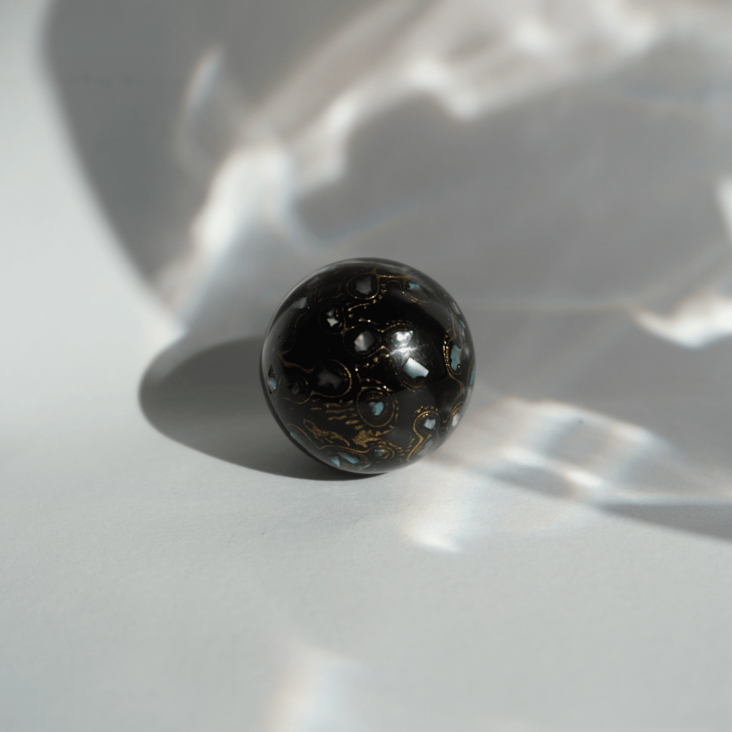 Rich Black ritual bead with high-gloss black finish, hand-layered organic resin_2