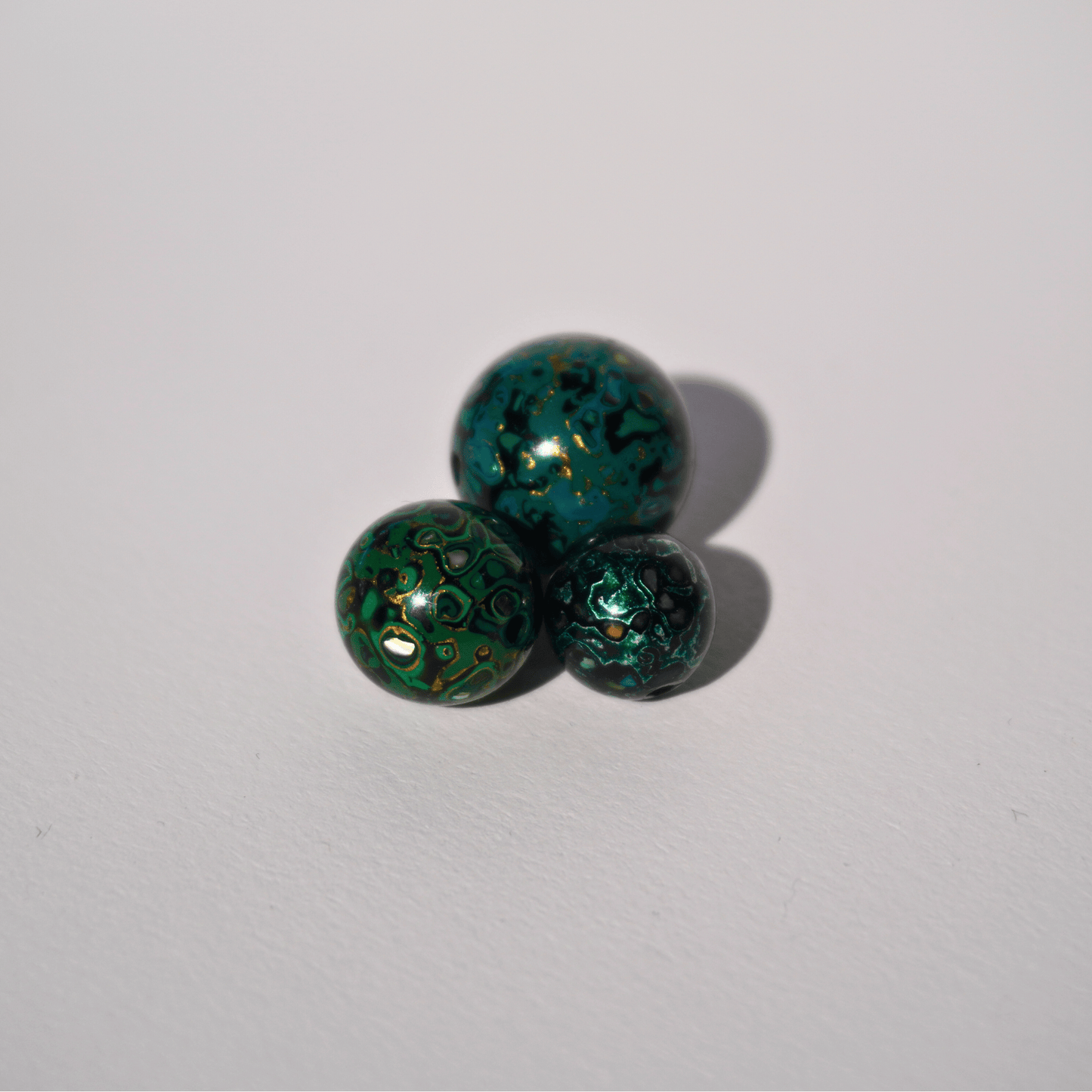 Smoky Seaweed ritual bead in ocean green and grey, hand-layered resin_cluster