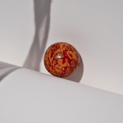 Flame_Tangerine_ritual_bead_in_radiant_orange_with_golden_highlights_hand-polished_resin