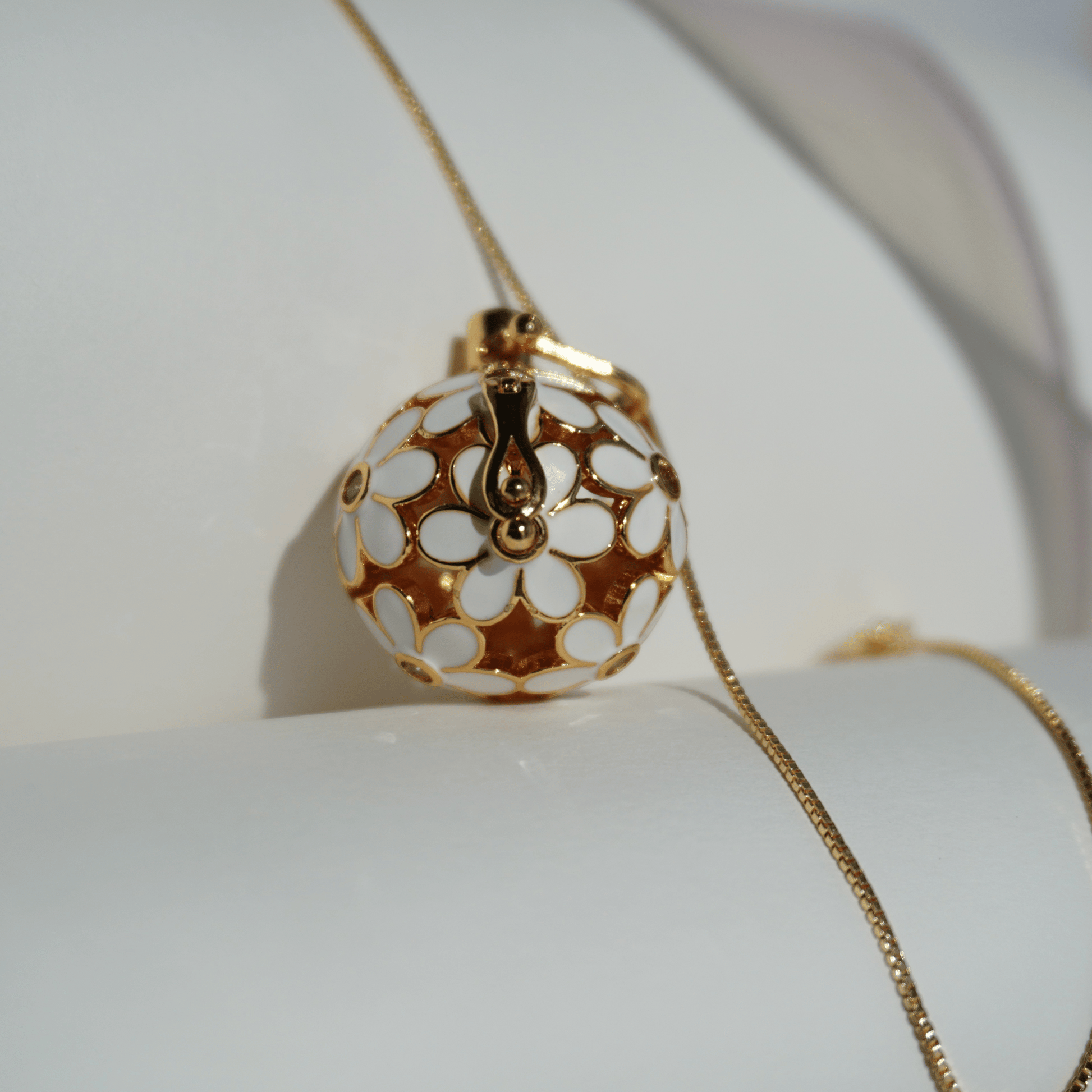 Gold floral cage pendant holder for ritual or crystal beads_close_up_with_chain