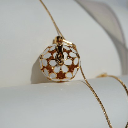 Gold floral cage pendant holder for ritual or crystal beads_close_up_with_chain
