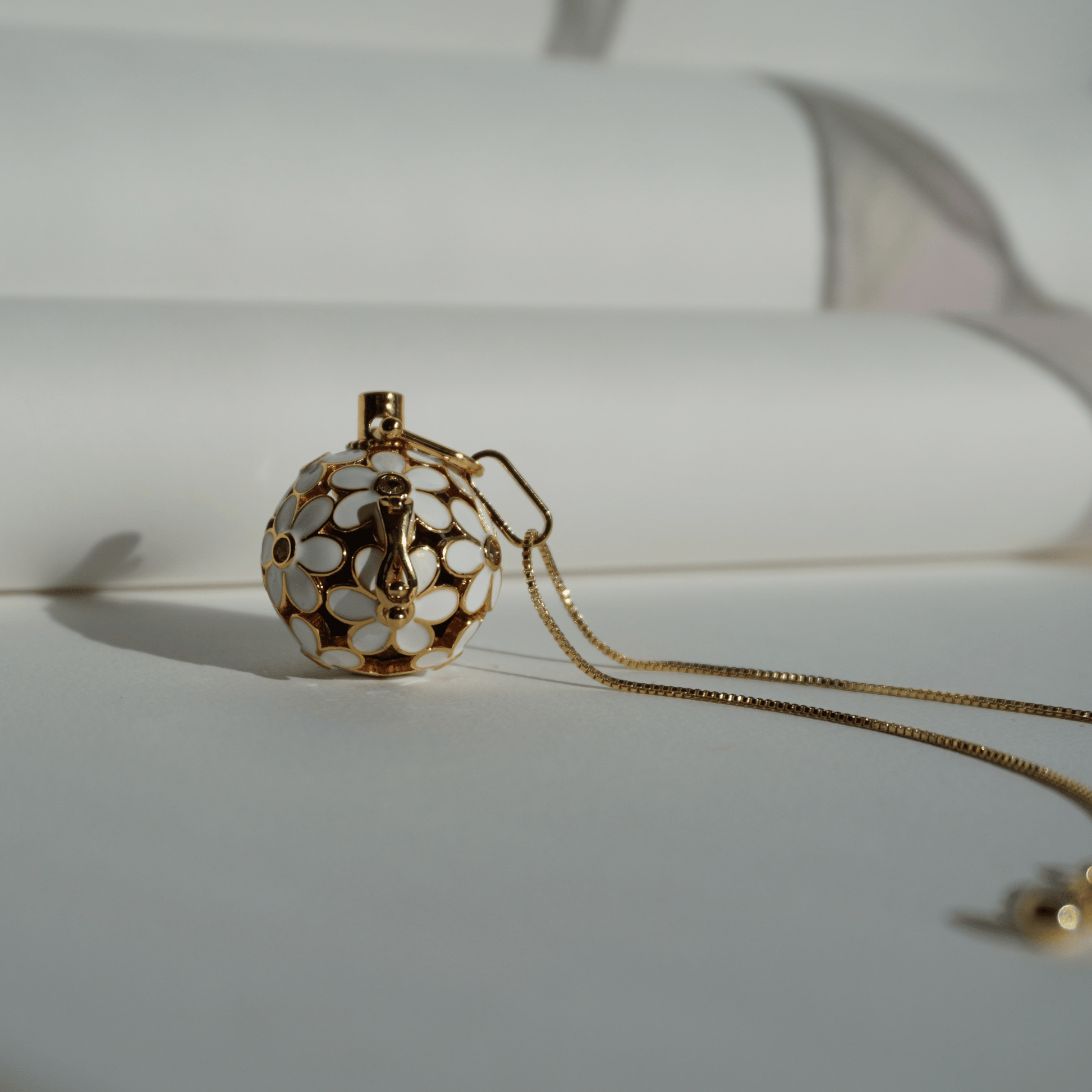 Gold floral cage pendant holder for ritual or crystal beads_upfront