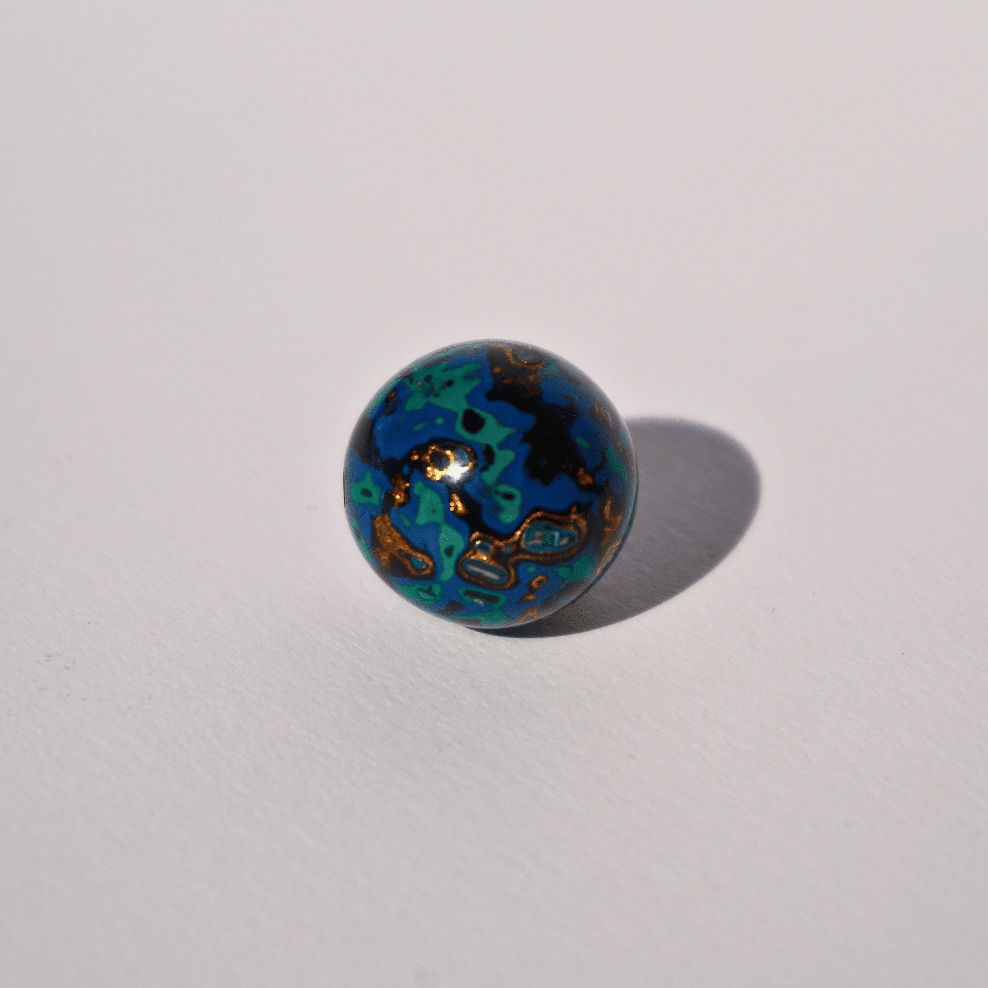 Indigo Gold ritual bead with celestial gold veining, handcrafted in plant-based resin_1