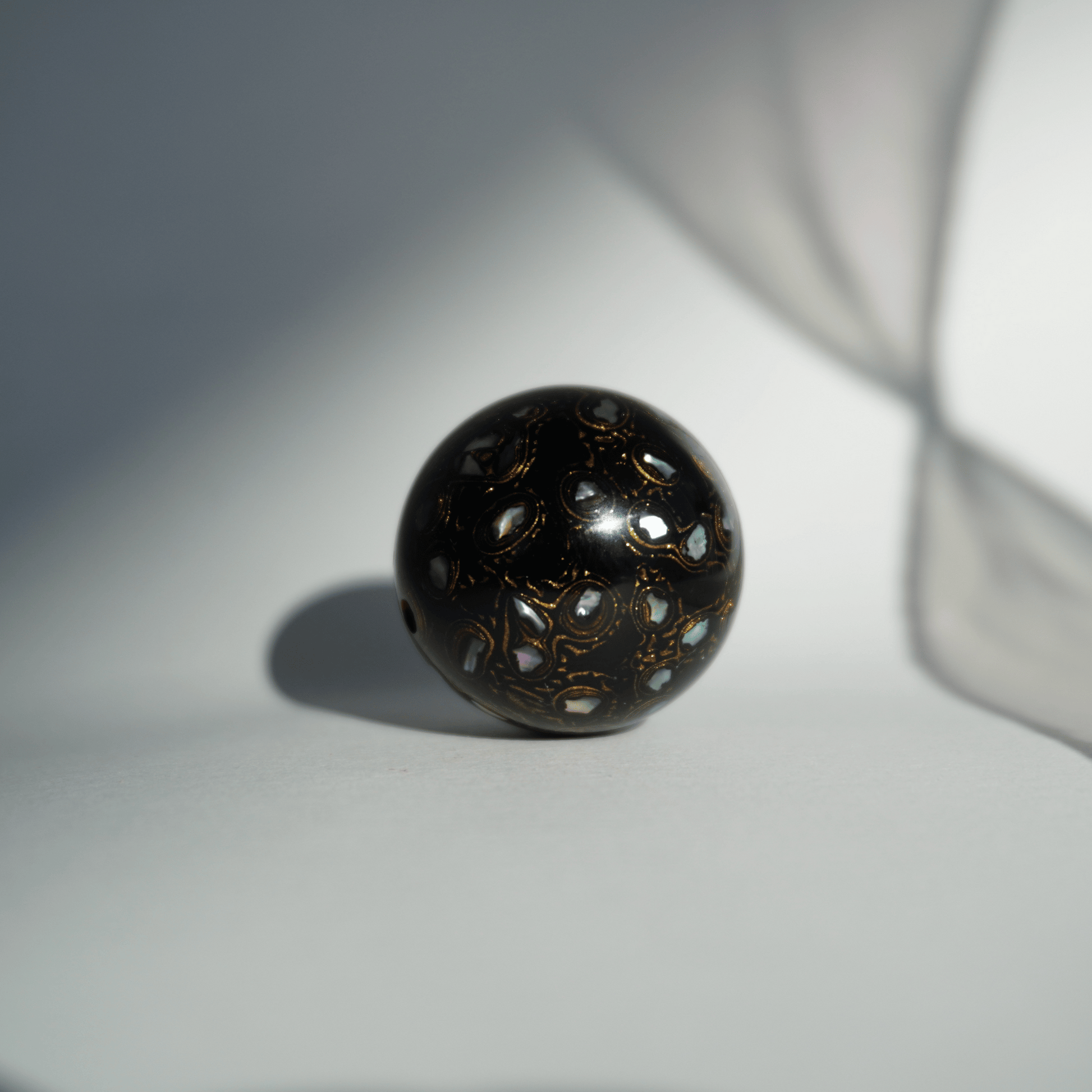 Rich Black bead with high-gloss black finish, hand-layered organic resin_1