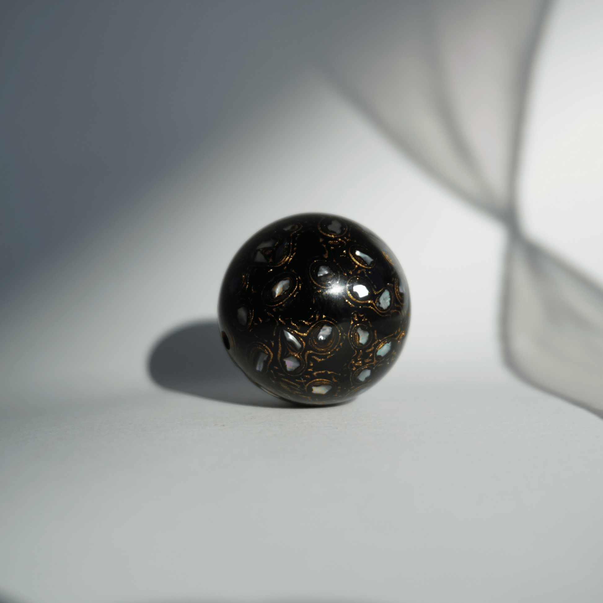 Rich Black ritual bead with high-gloss black finish, hand-layered organic resin_1