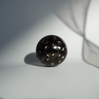 Rich Black ritual bead with high-gloss black finish, hand-layered organic resin_1