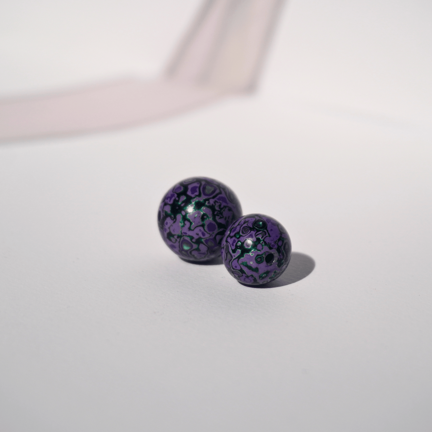 Wisteria Hedge ritual bead in lavender grey with soft glow, hand-polished resin_duo