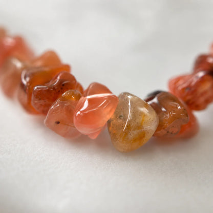 Close-up of natural Nanhong red agate stone chips