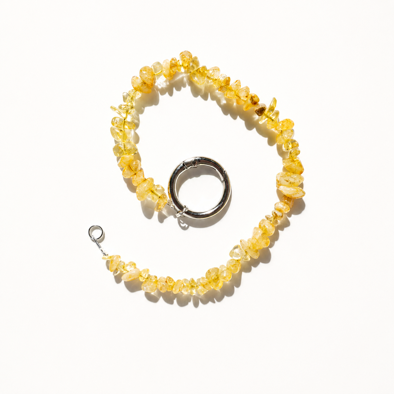 Natural yellow quartz stone phone charm with polished stone chips in a whirl