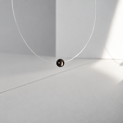 Stardust — Collier à perle flottante en obsidienne à reflets argentés