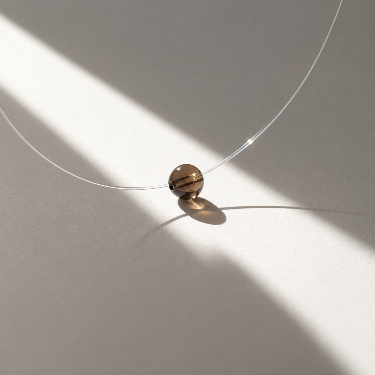 Twilight — Collier à perle flottante en quartz fumé
