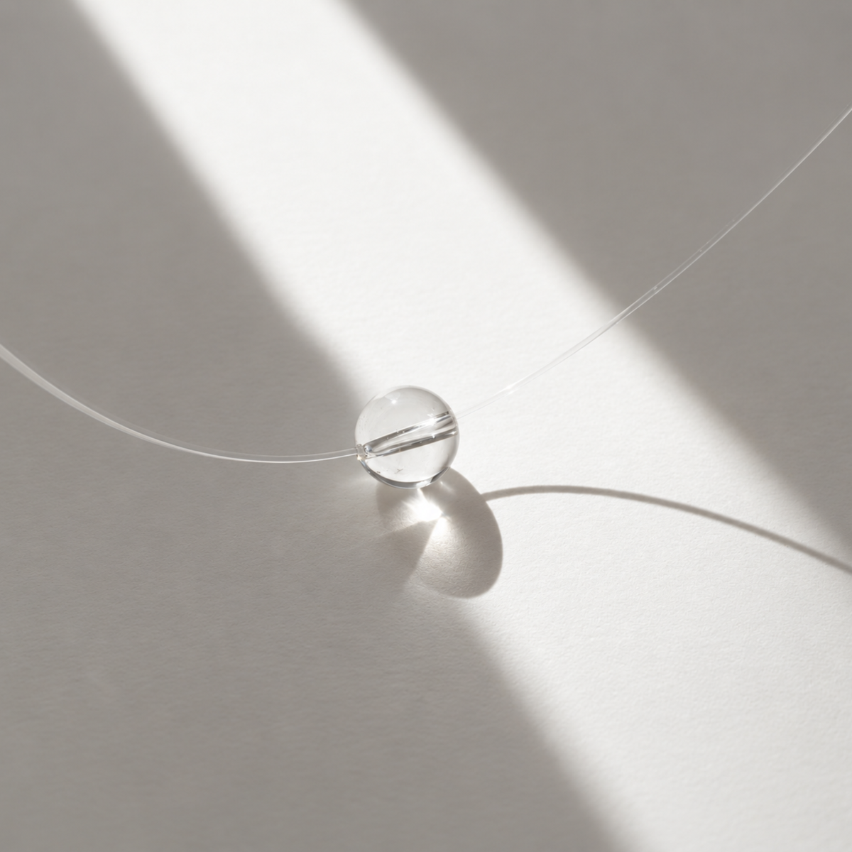 floating-bead-choker-sea-bulle-clear-quartz-sunlight